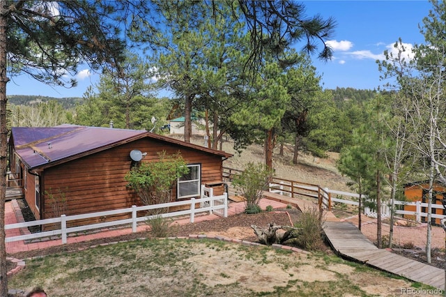 840 Obsidian Dr, Florissant, CO 80816 - view of side of home featuring a forest view and metal roof