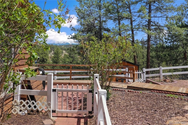 840 Obsidian Dr, Florissant, CO 80816 - fenced yard featuring a gate and an outbuilding