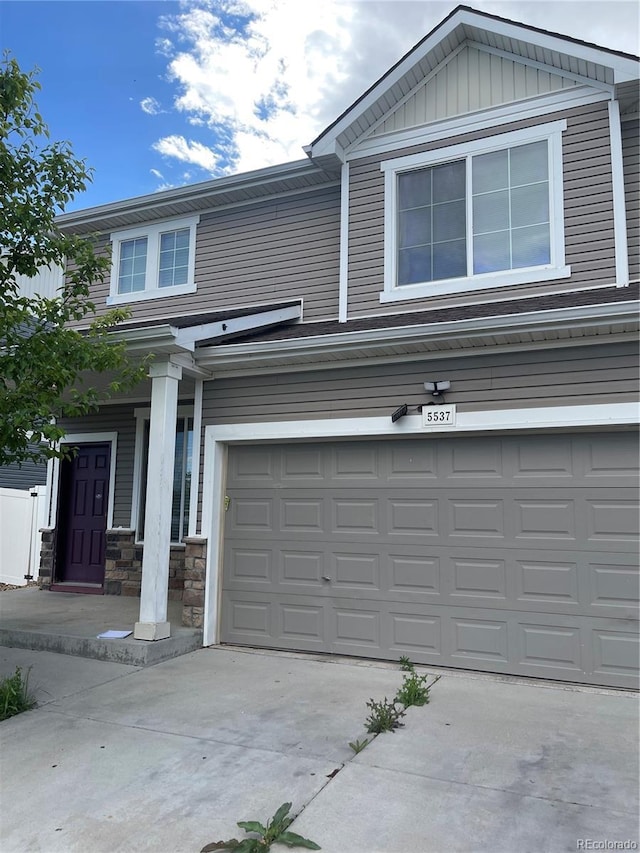 5537 Malta St, Denver, CO 80249 - view of front of home with an attached garage and concrete driveway