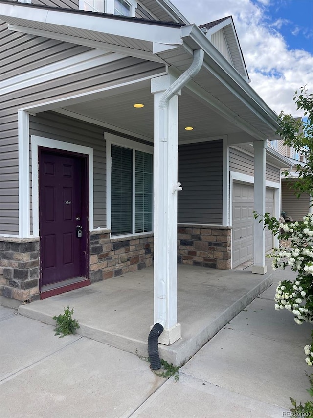 5537 Malta St, Denver, CO 80249 - property entrance with stone siding and a porch