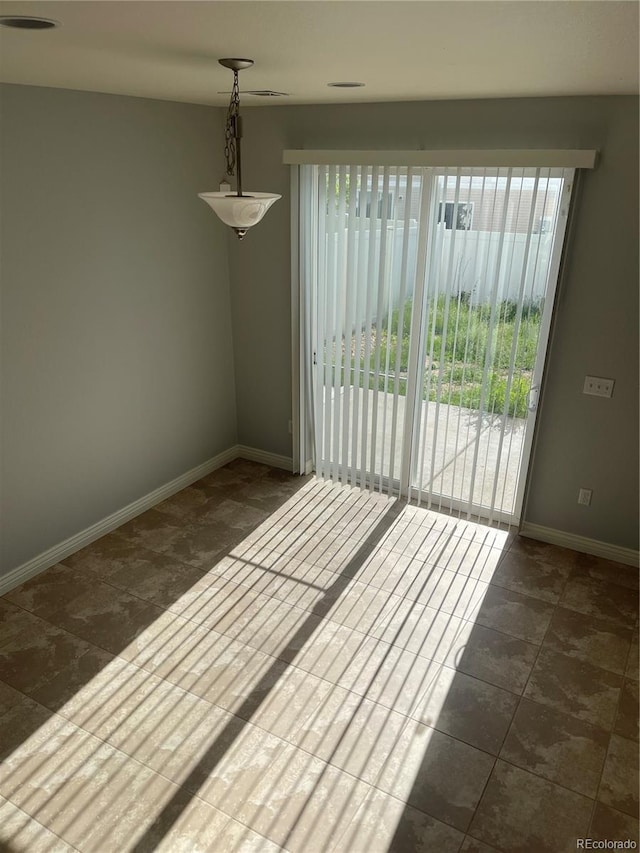 5537 Malta St, Denver, CO 80249 - empty room featuring baseboards