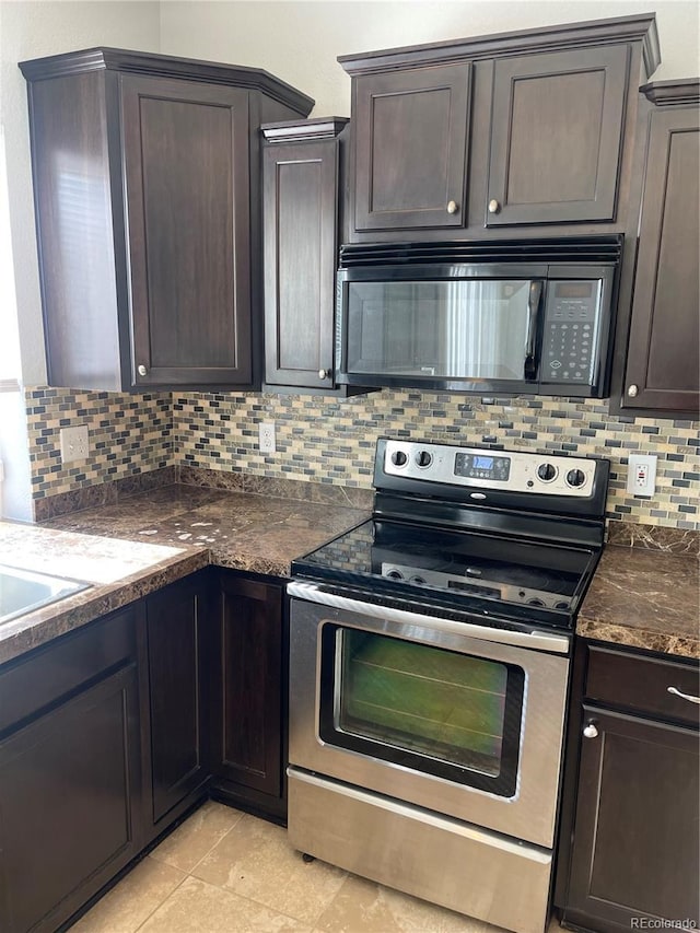 5537 Malta St, Denver, CO 80249 - kitchen featuring black microwave, stainless steel electric range oven, backsplash, dark brown cabinets, and light tile patterned flooring