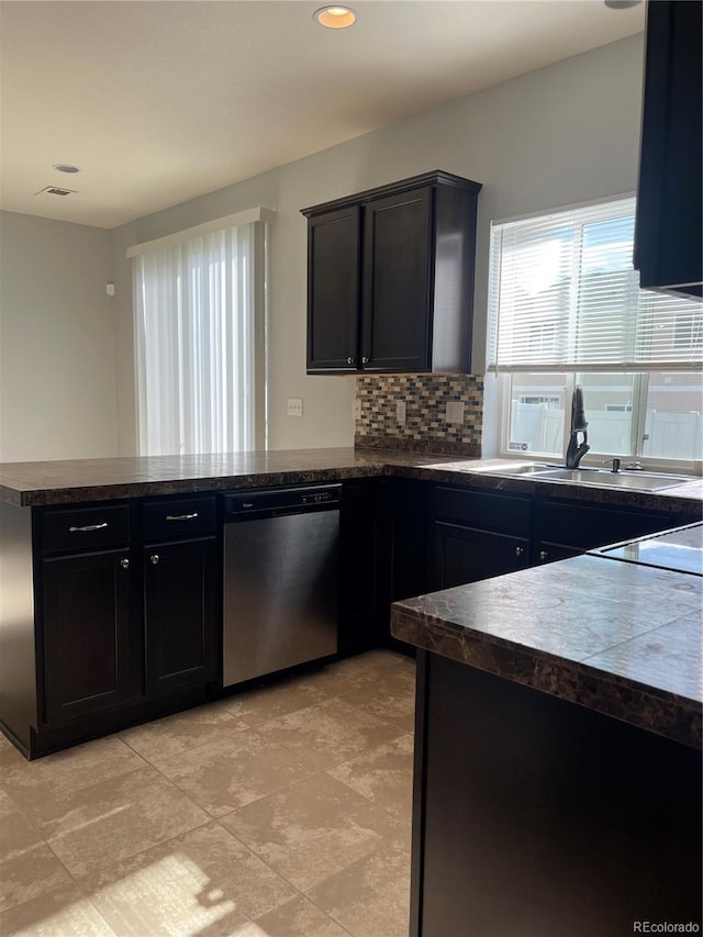 5537 Malta St, Denver, CO 80249 - kitchen featuring dishwasher, a peninsula, dark countertops, tasteful backsplash, and recessed lighting