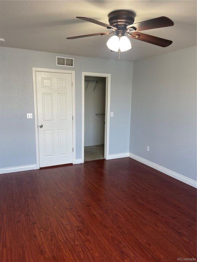5537 Malta St, Denver, CO 80249 - unfurnished bedroom featuring baseboards, wood finished floors, ceiling fan, and a closet