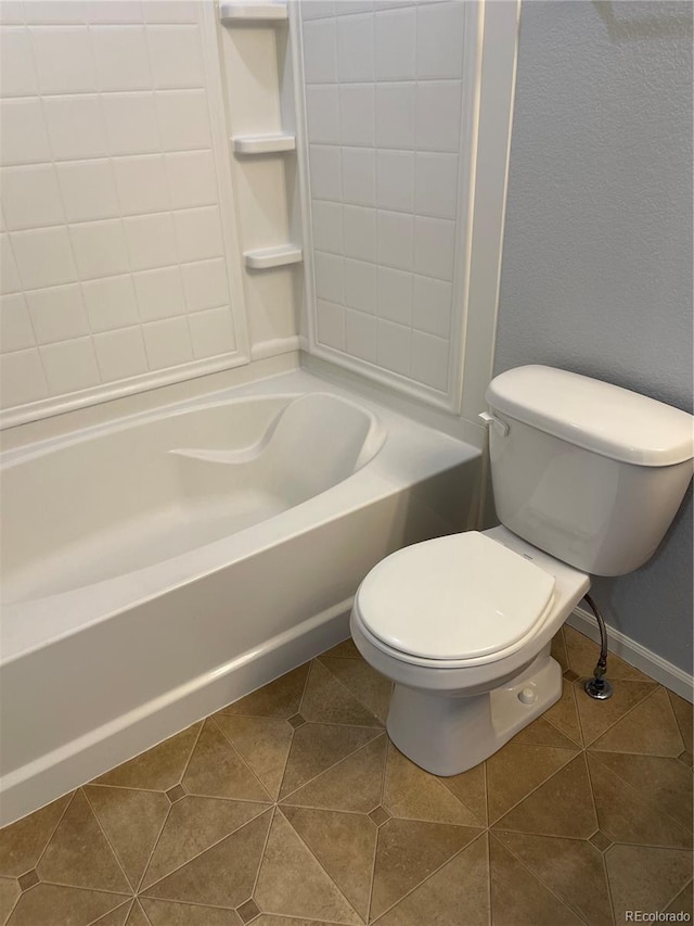 5537 Malta St, Denver, CO 80249 - bathroom with toilet, tile patterned floors, and baseboards