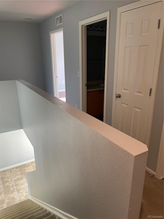 5537 Malta St, Denver, CO 80249 - staircase featuring baseboards