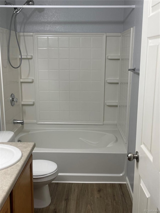 5537 Malta St, Denver, CO 80249 - full bath featuring toilet, wood finished floors, vanity, and shower / tub combination