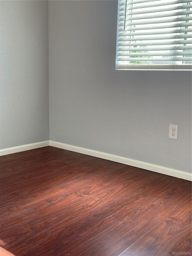 5537 Malta St, Denver, CO 80249 - spare room with baseboards and wood finished floors