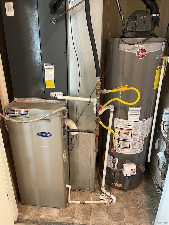 5537 Malta St, Denver, CO 80249 - utility room featuring gas water heater and heating unit