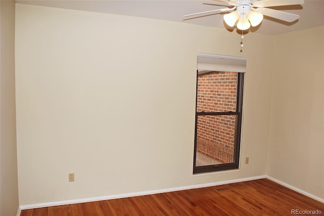 unfurnished room with wood finished floors, baseboards, and ceiling fan