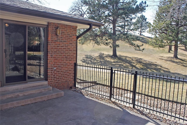 view of patio featuring fence and entry steps