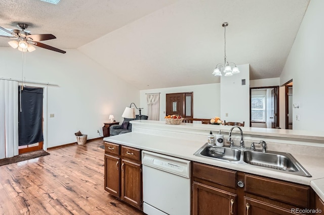4162 S Dunkirk Way, Aurora, CO 80013 - kitchen featuring dishwasher, vaulted ceiling, light wood-style floors, ceiling fan, and light countertops