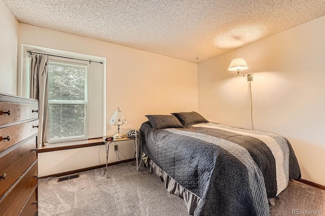 4162 S Dunkirk Way, Aurora, CO 80013 - carpeted bedroom featuring baseboards and a textured ceiling
