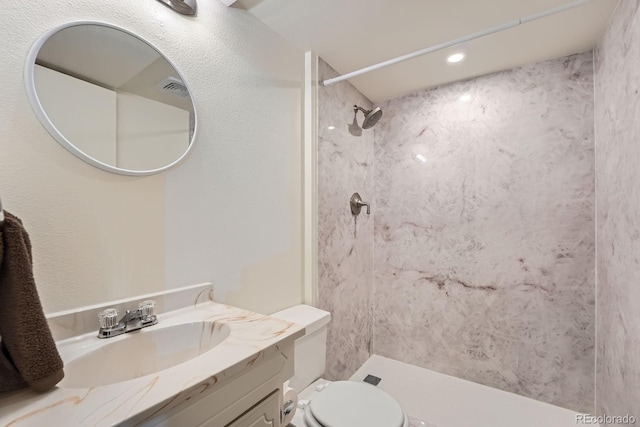 4162 S Dunkirk Way, Aurora, CO 80013 - full bath with vanity, a shower, and recessed lighting
