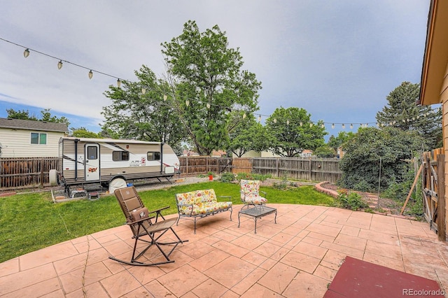 4162 S Dunkirk Way, Aurora, CO 80013 - fenced backyard featuring a patio area and an outdoor structure