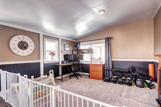 home office featuring plenty of natural light, wainscoting, carpet, and vaulted ceiling