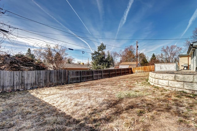 view of yard featuring a fenced backyard