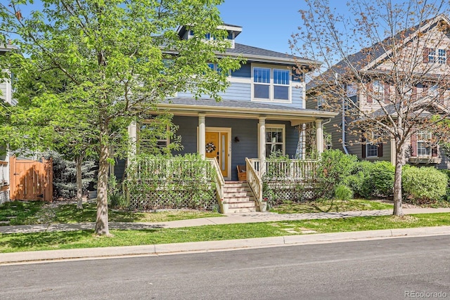 3386 Beeler Ct, Denver, CO 80238 - american foursquare style home featuring covered porch and fence
