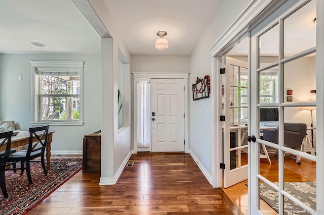 3386 Beeler Ct, Denver, CO 80238 - foyer entrance featuring hardwood / wood-style flooring, french doors, and baseboards