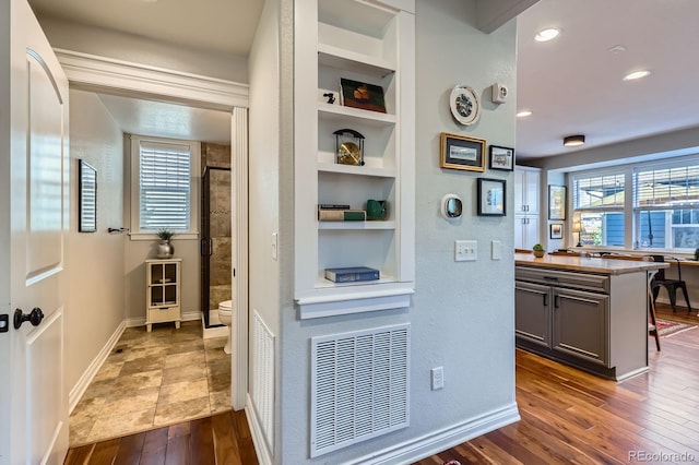 3386 Beeler Ct, Denver, CO 80238 - hall featuring built in features, dark wood-style flooring, recessed lighting, and baseboards