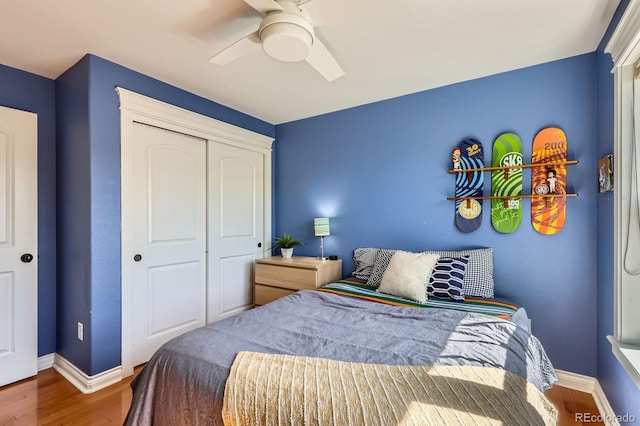 3386 Beeler Ct, Denver, CO 80238 - bedroom with baseboards, wood finished floors, a closet, and a ceiling fan