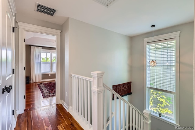 3386 Beeler Ct, Denver, CO 80238 - hall with an upstairs landing, dark wood-type flooring, and baseboards