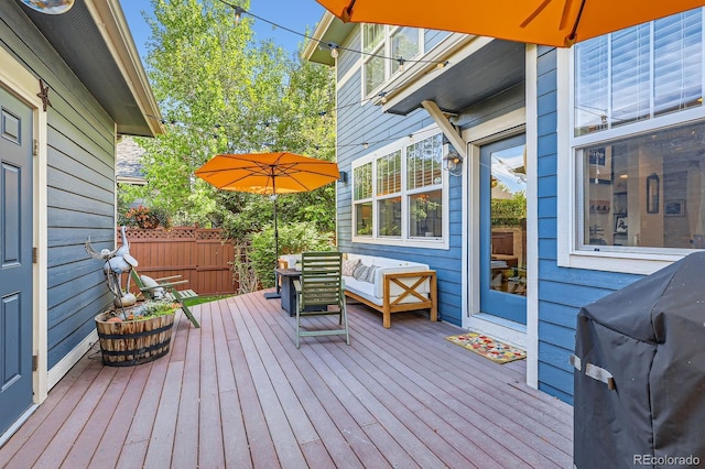 3386 Beeler Ct, Denver, CO 80238 - wooden terrace featuring an outdoor hangout area, a grill, and fence