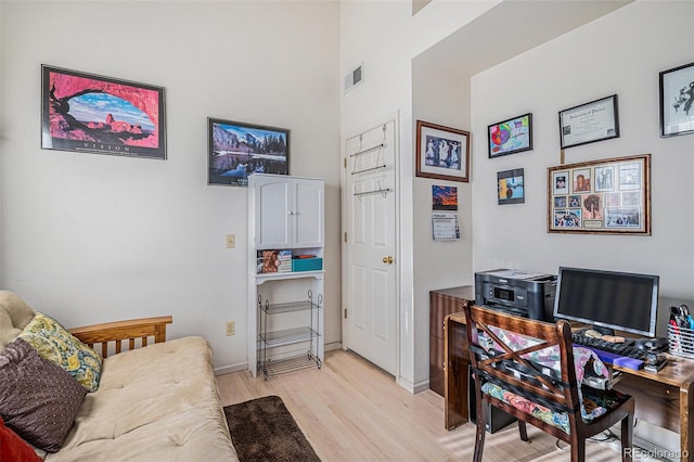 home office with light wood-type flooring