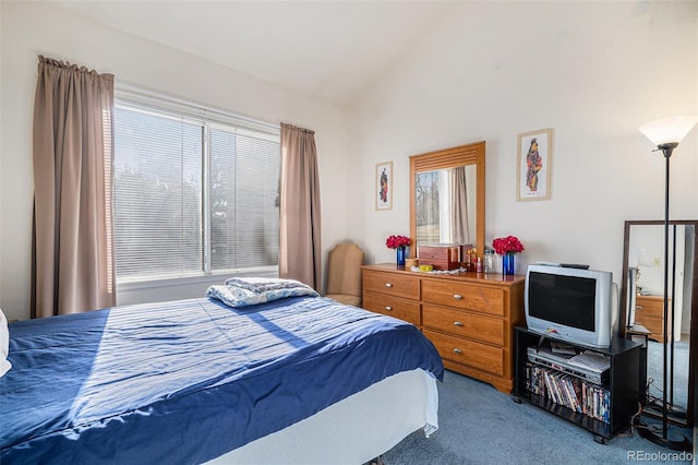 bedroom featuring vaulted ceiling and carpet floors