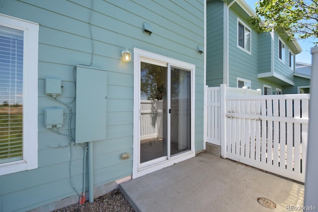 property entrance featuring a patio