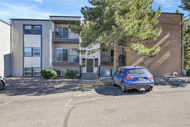 view of front of property featuring uncovered parking