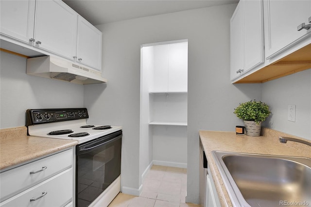 kitchen featuring white electric range oven, light countertops, white cabinets, a sink, and under cabinet range hood