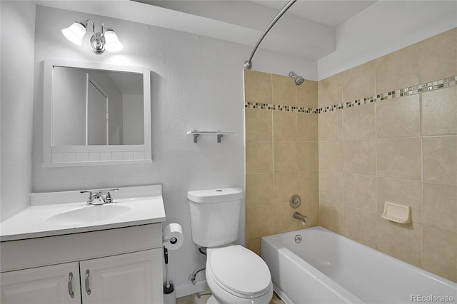 bathroom featuring toilet, vanity, and shower / bathing tub combination