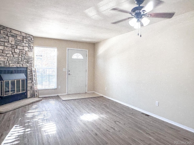15475 E Louisiana Ave, Aurora, CO 80017 - entrance foyer featuring wood finished floors, baseboards, and a textured ceiling