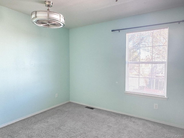 15475 E Louisiana Ave, Aurora, CO 80017 - spare room featuring carpet and baseboards