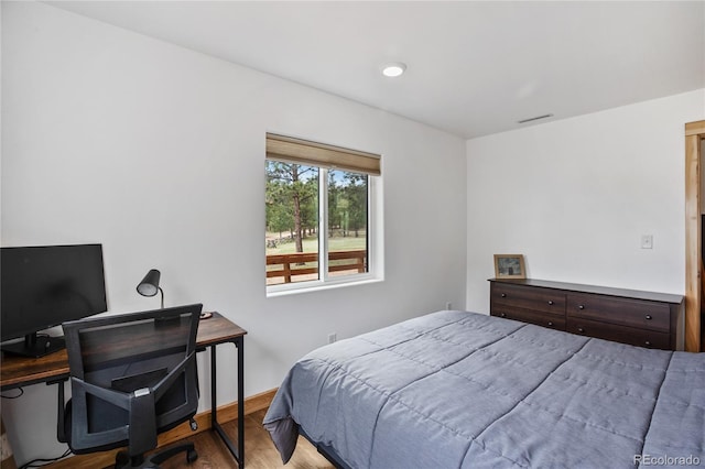 437 Langnis Rd, Guffey, CO 80820 - bedroom with wood finished floors, an office area, and baseboards