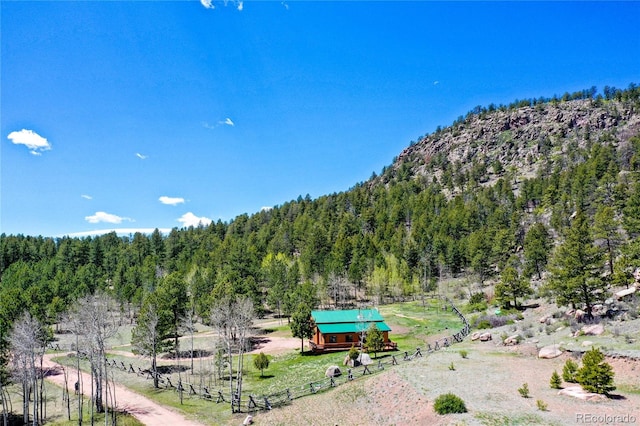 437 Langnis Rd, Guffey, CO 80820 - view of mountain background featuring a heavily wooded area and rural landscape