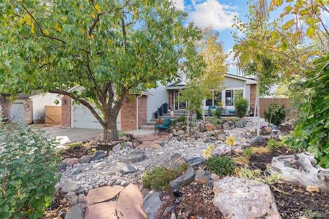 obstructed view of property with a garage