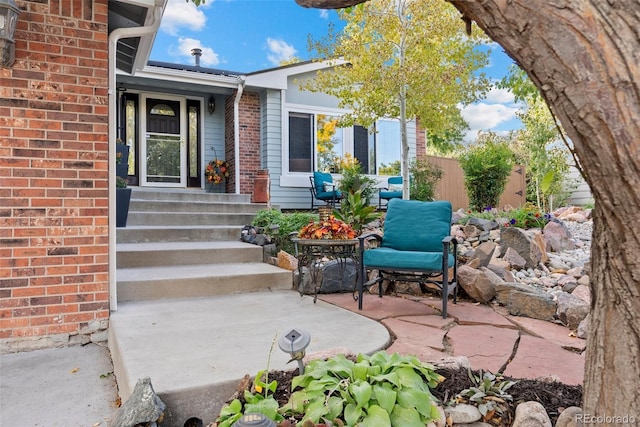 doorway to property with a patio