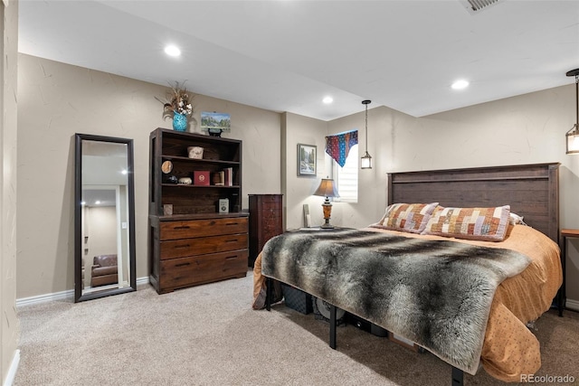 bedroom with light colored carpet