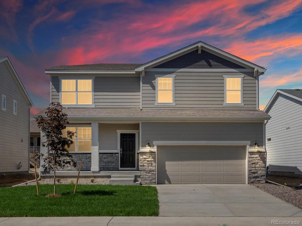 view of front facade featuring a garage and covered porch