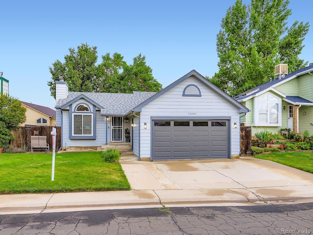 12646 Osceola St, Broomfield, CO 80020 - view of front of house with a garage, concrete driveway, a chimney, and a shingled roof