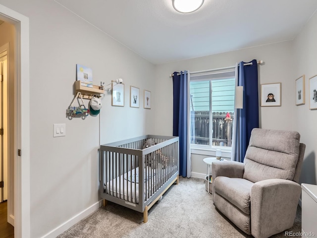 12646 Osceola St, Broomfield, CO 80020 - carpeted bedroom featuring a nursery area and baseboards
