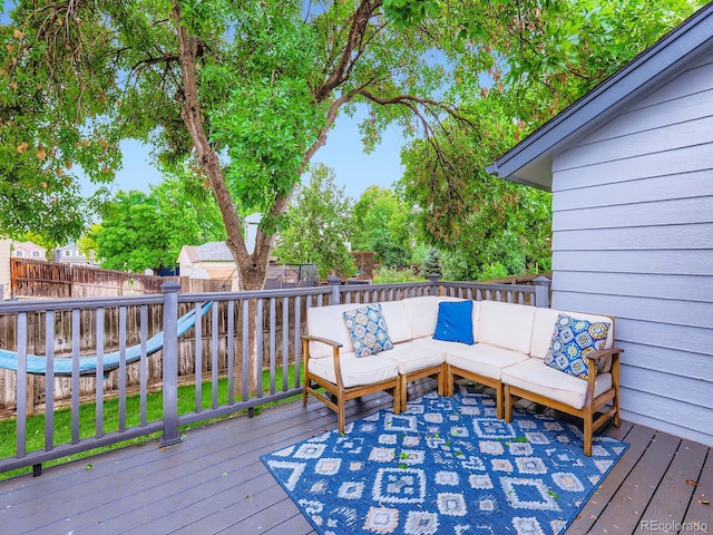 12646 Osceola St, Broomfield, CO 80020 - wooden terrace featuring outdoor lounge area and a fenced backyard