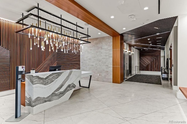 1901 Wazee St Unit 419, Denver, CO 80202 - reception area featuring recessed lighting, wood walls, and a chandelier