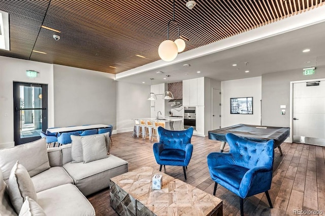 1901 Wazee St Unit 419, Denver, CO 80202 - living room with billiards table, light wood finished floors, and recessed lighting