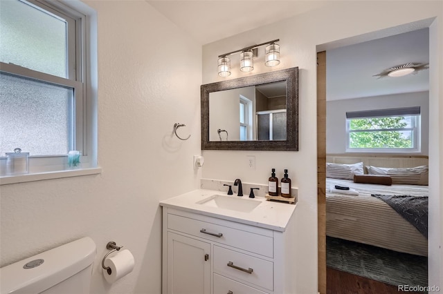 7746 S Gray St, Littleton, CO 80128 - full bath featuring toilet, vanity, and an enclosed shower