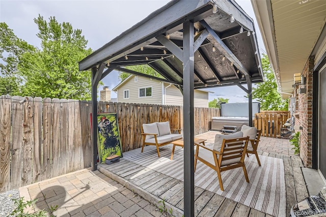 7746 S Gray St, Littleton, CO 80128 - wooden deck featuring a fenced backyard, a gazebo, outdoor lounge area, and a patio