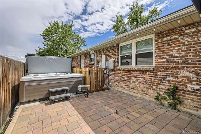 7746 S Gray St, Littleton, CO 80128 - fenced backyard with a hot tub and a patio