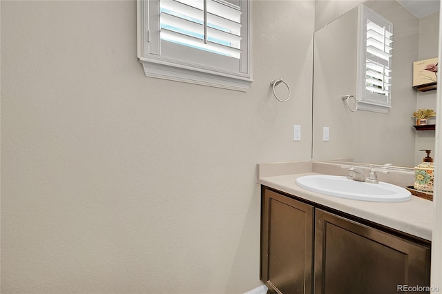 bathroom featuring vanity and a wealth of natural light